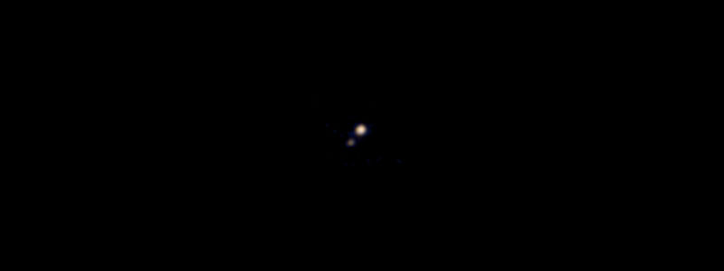 Pluto & it's first moon Charon.